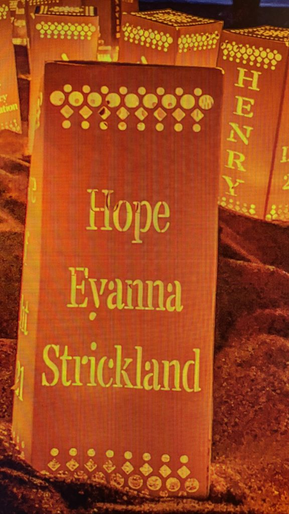 Luminaria bags carrying babies names lit during the Wave of Light
