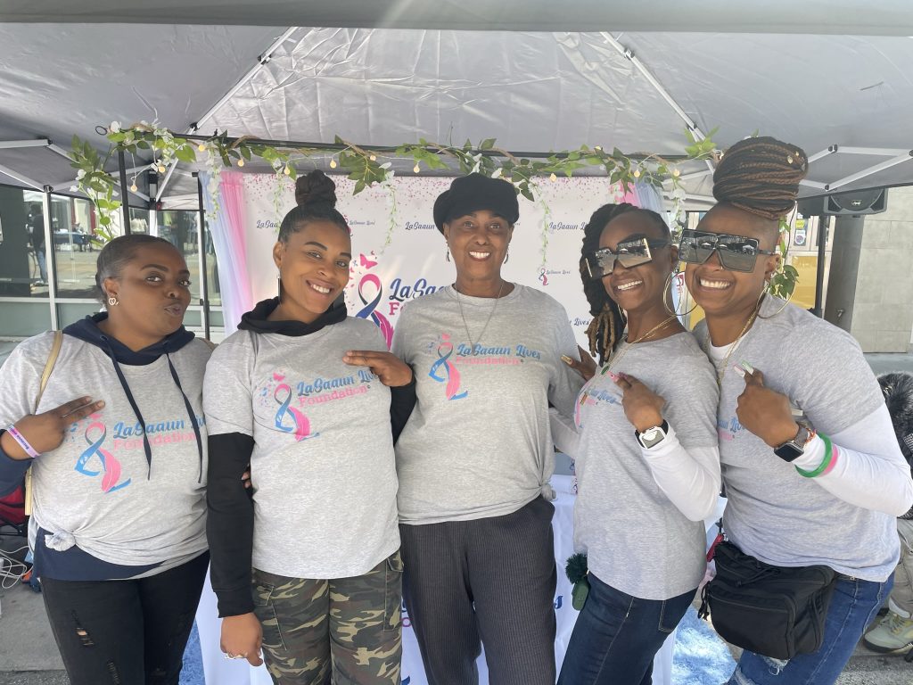 Community members in matching shirts at a LaSaaun Lives family gathering