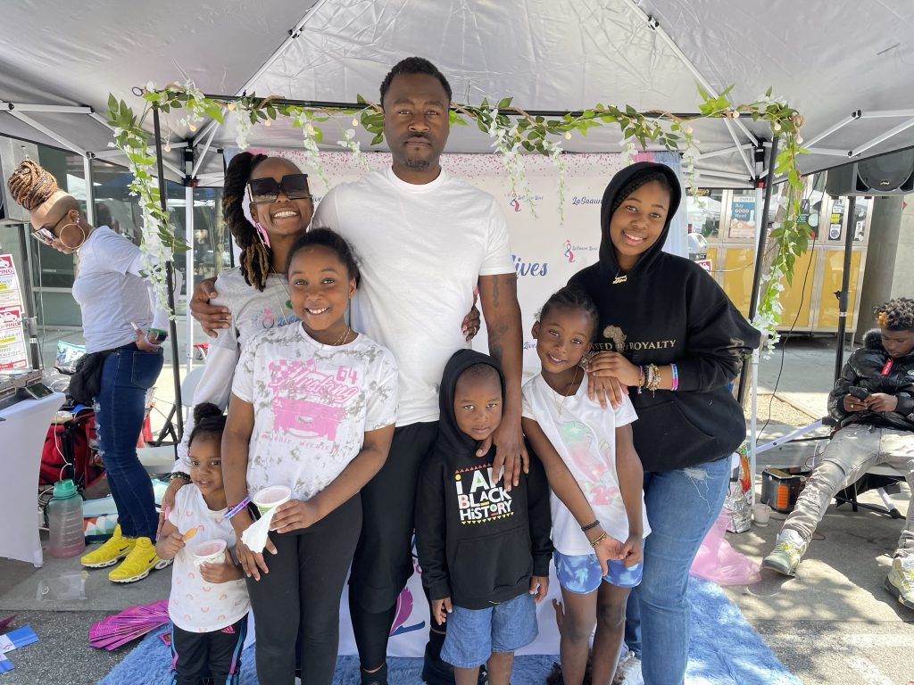 A family together at a LaSaaun Lives Foundation community event