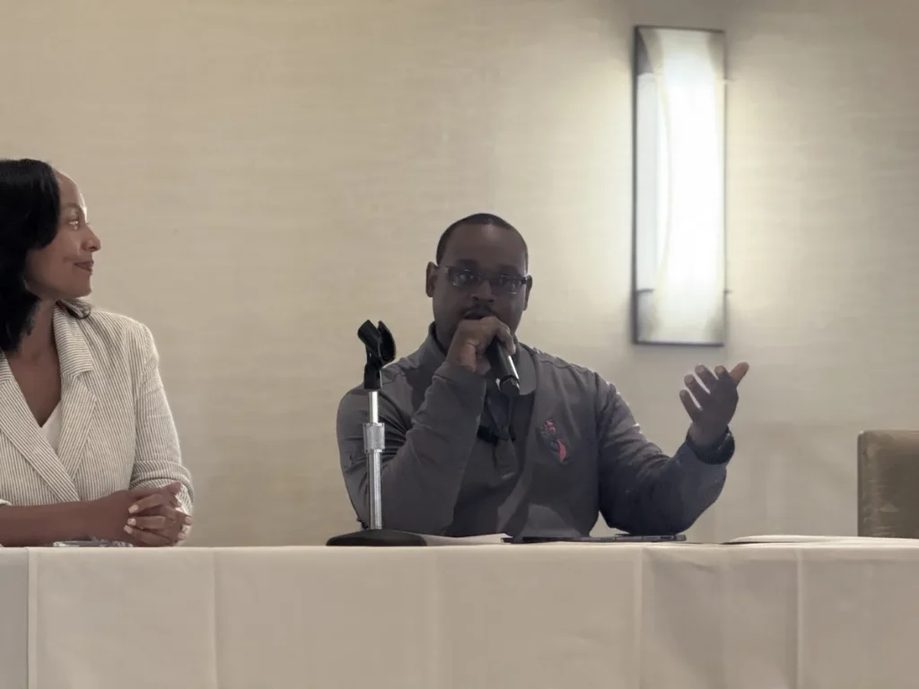 RELL Speaks father-to-father conversation during a community panel discussion