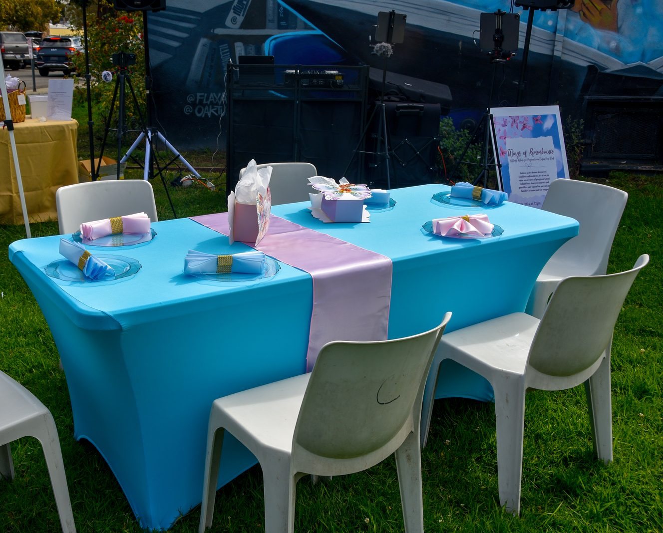 The Wings of Remembrance table, with signage and keepsakes laid out for the gathering.